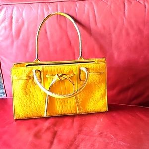 Mustard yellow leather purse.